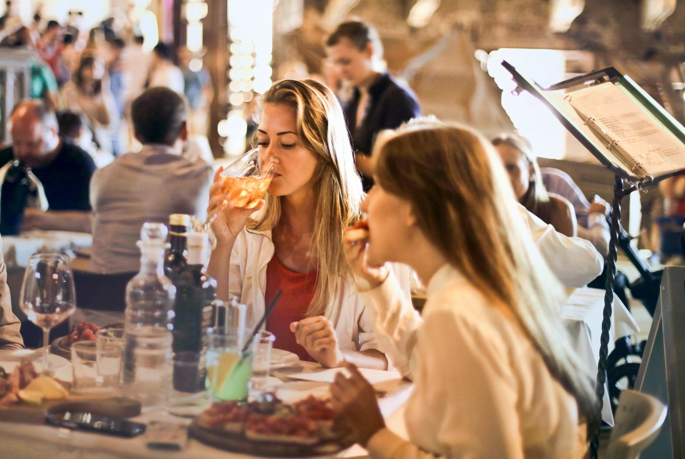 Tourist eating Milanese food | Photo Credits: Andrea Piacquadio on Pexels