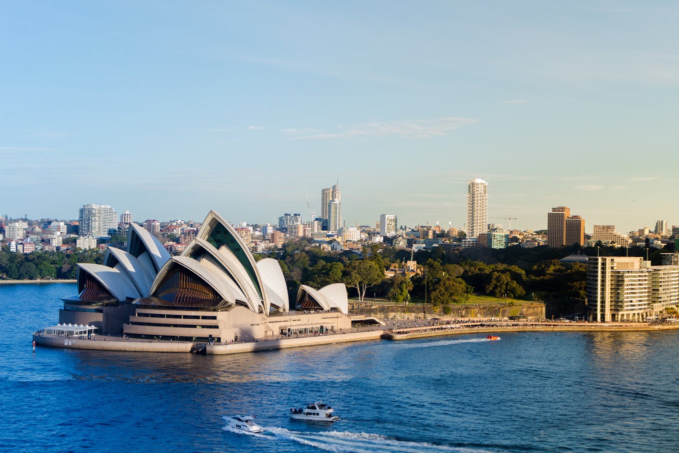Aerial view of Sydney Opera House with harbour and city skyline
