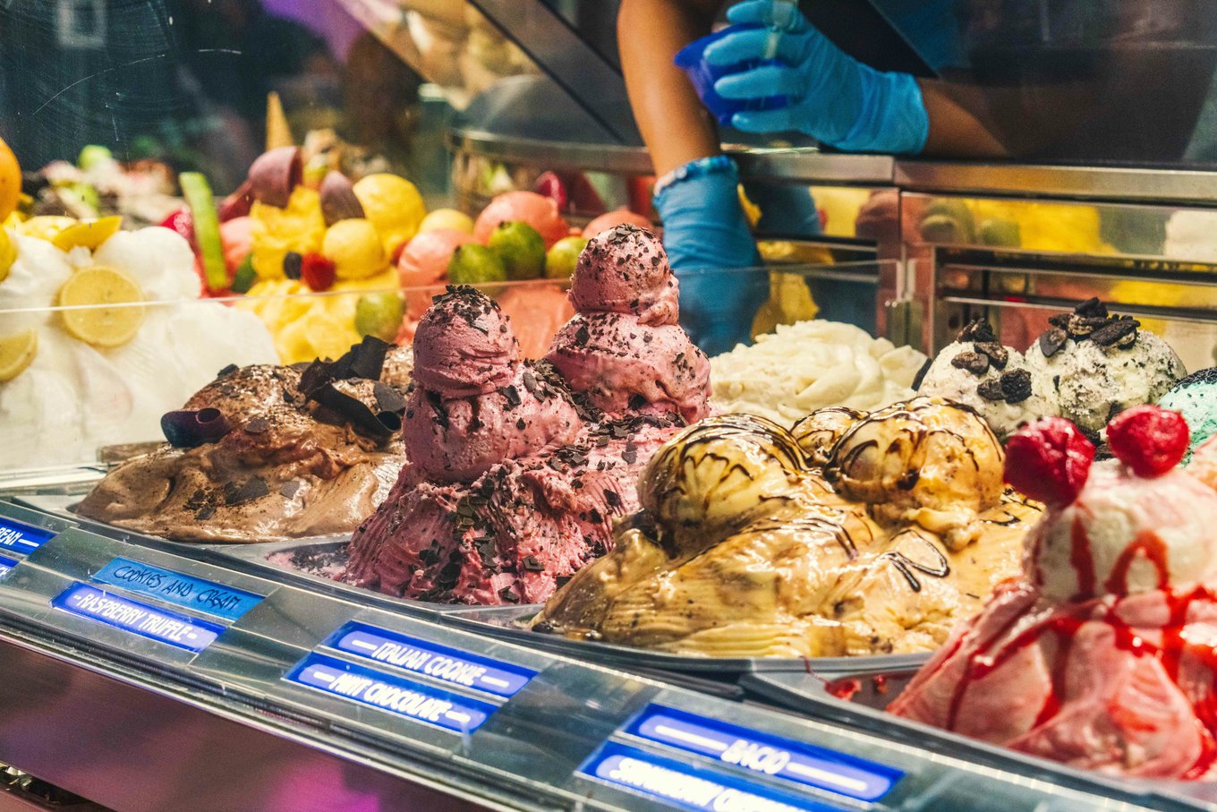 Assorted gelato flavors in a Rome gelateria showcasing creamy textures and rich colors