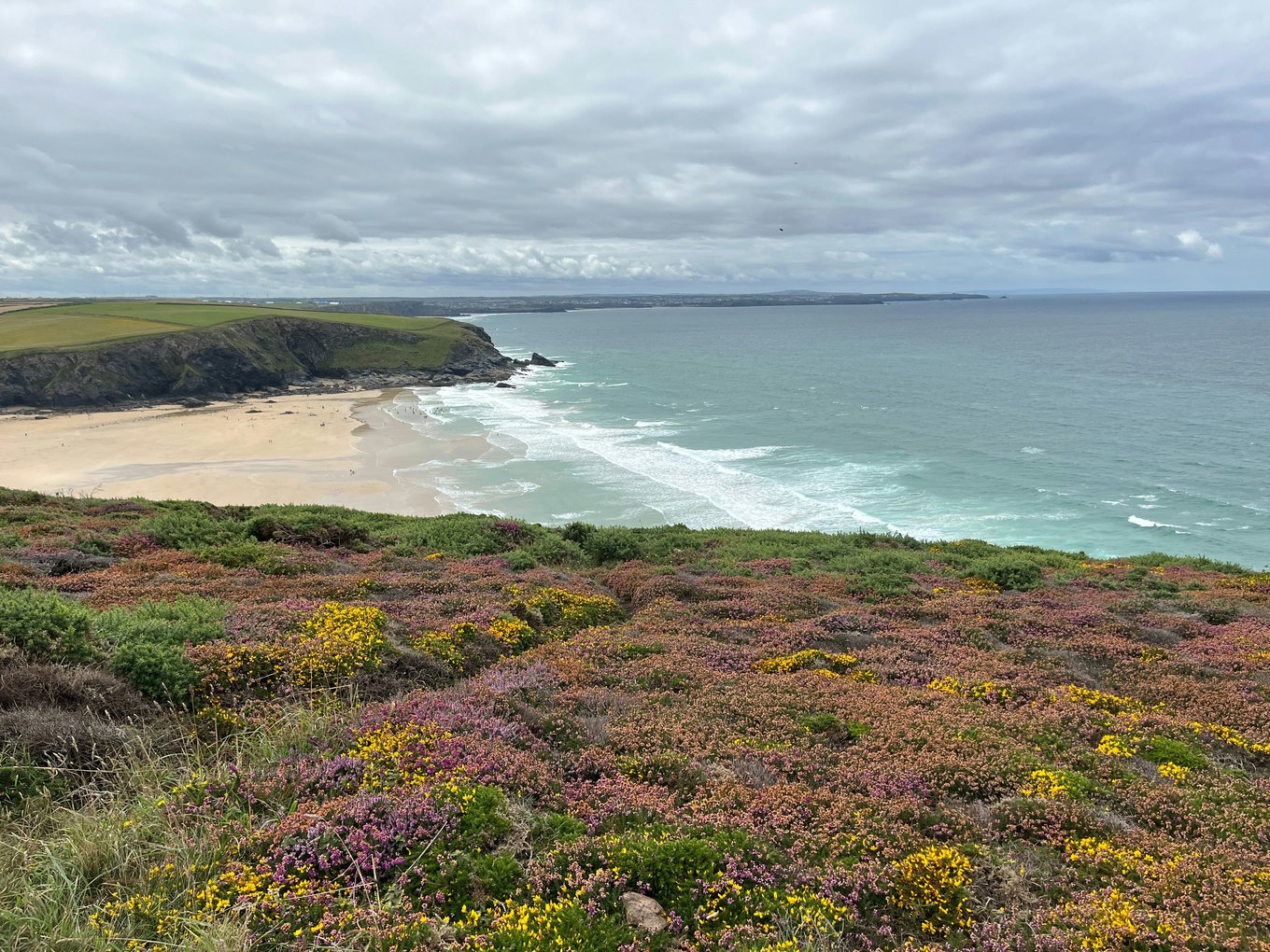  Newquay Beach cliffs and coastal view | Photo Credit: Emily K on Unplash