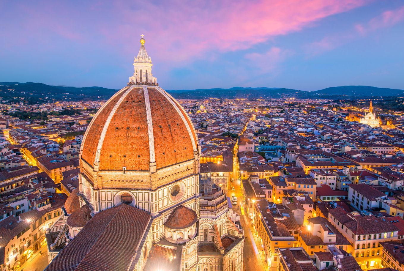 Sunset view of Florence's iconic dome, overlooking the city's rooftops