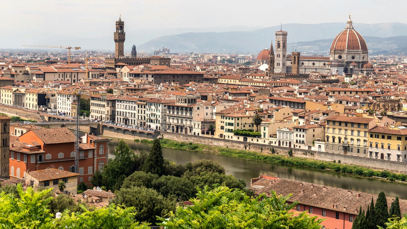 Aerial view of Florence with the Duomo, Palazzo Vecchio, and Arno River