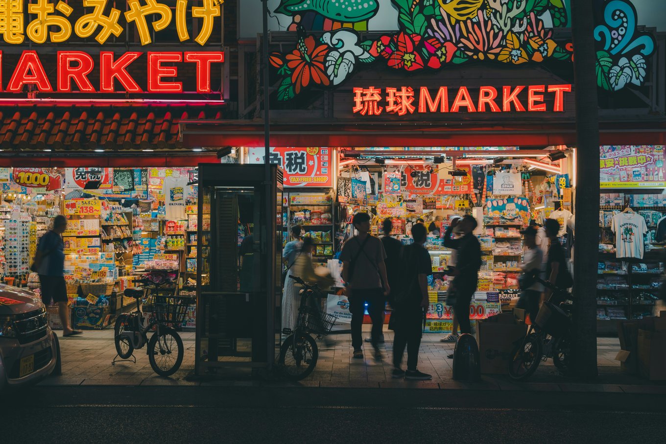 Neon-lit market storefront in Naha, Okinawa at night | Photo Credit: Krisna Yuda on Unsplash