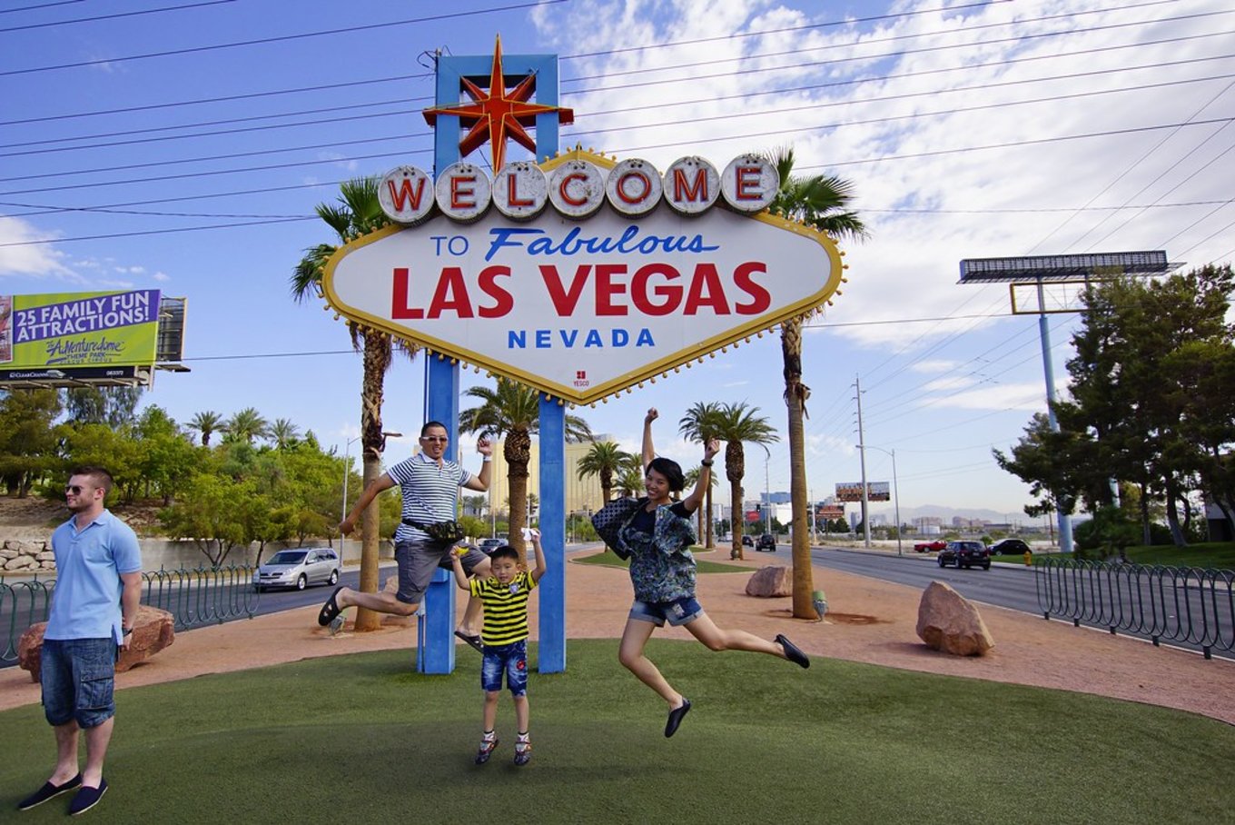  Family posing and jumping in front of the Welcome to Fabulous Las Vegas sign | Photo Credit: Flickr