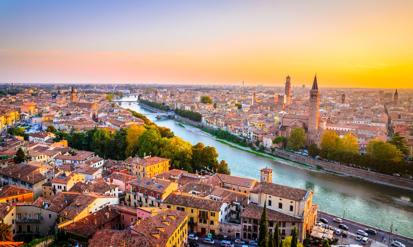 Scenic panorama of Verona, Italy, featuring the Adige River and iconic buildings