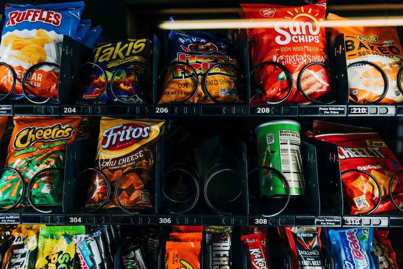 Colorful snack chips with assorted crisps and corn chips on display | Photo from Veronica on Pexels