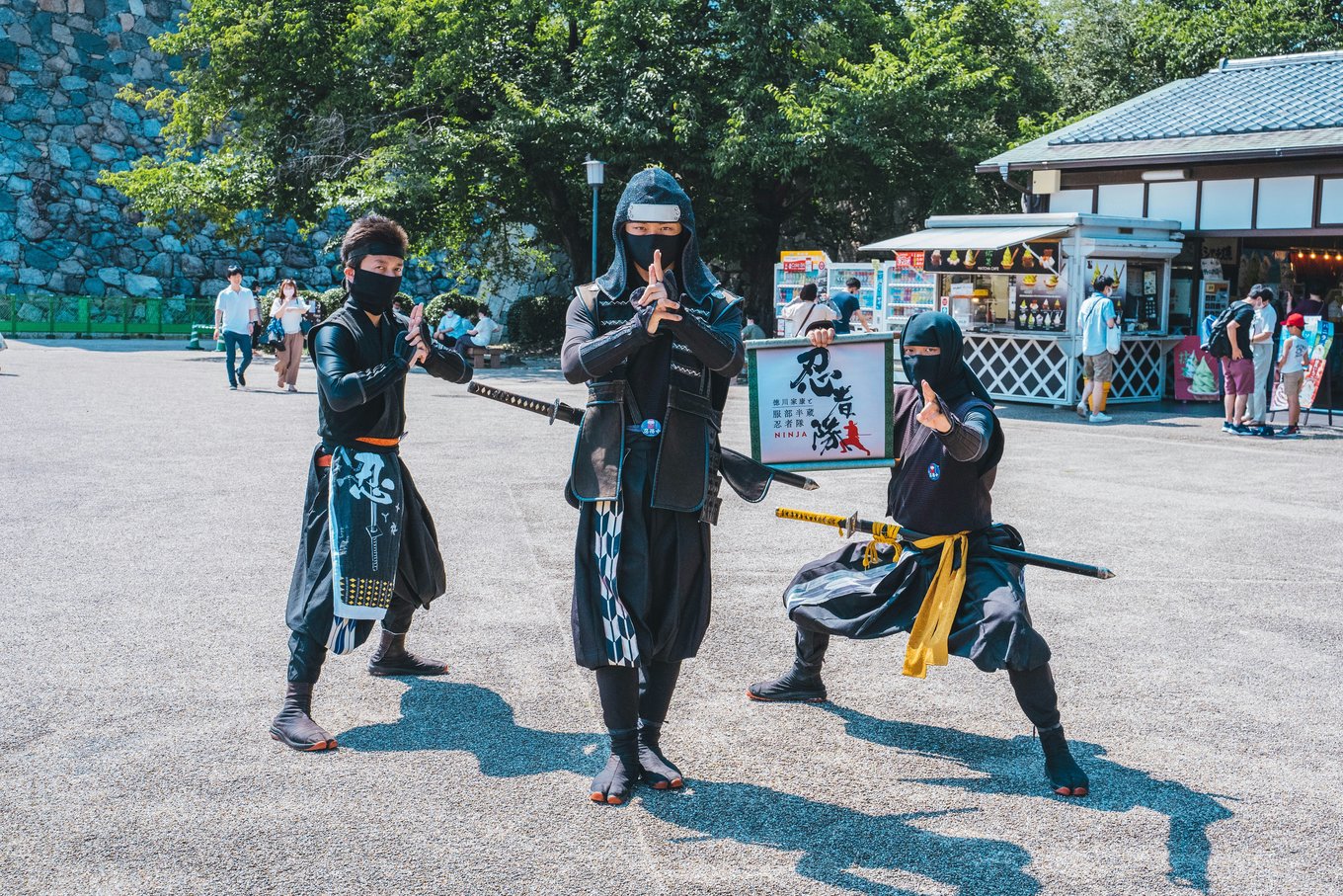 Ninja performers posing in traditional attire near a Nagoya castle | Photo Credit: Roméo A. on Unsplash