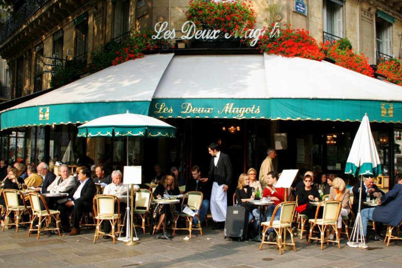 Outdoor dining at the iconic Les Deux Magots café in Paris | Photo Credit: Freerange Stock