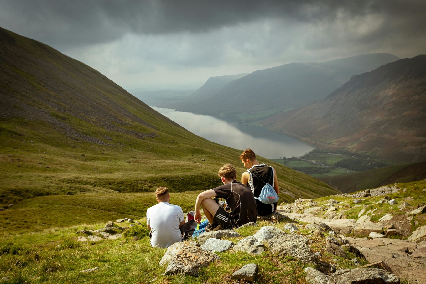 Hikers overlooking from Scafell Pike in the UK