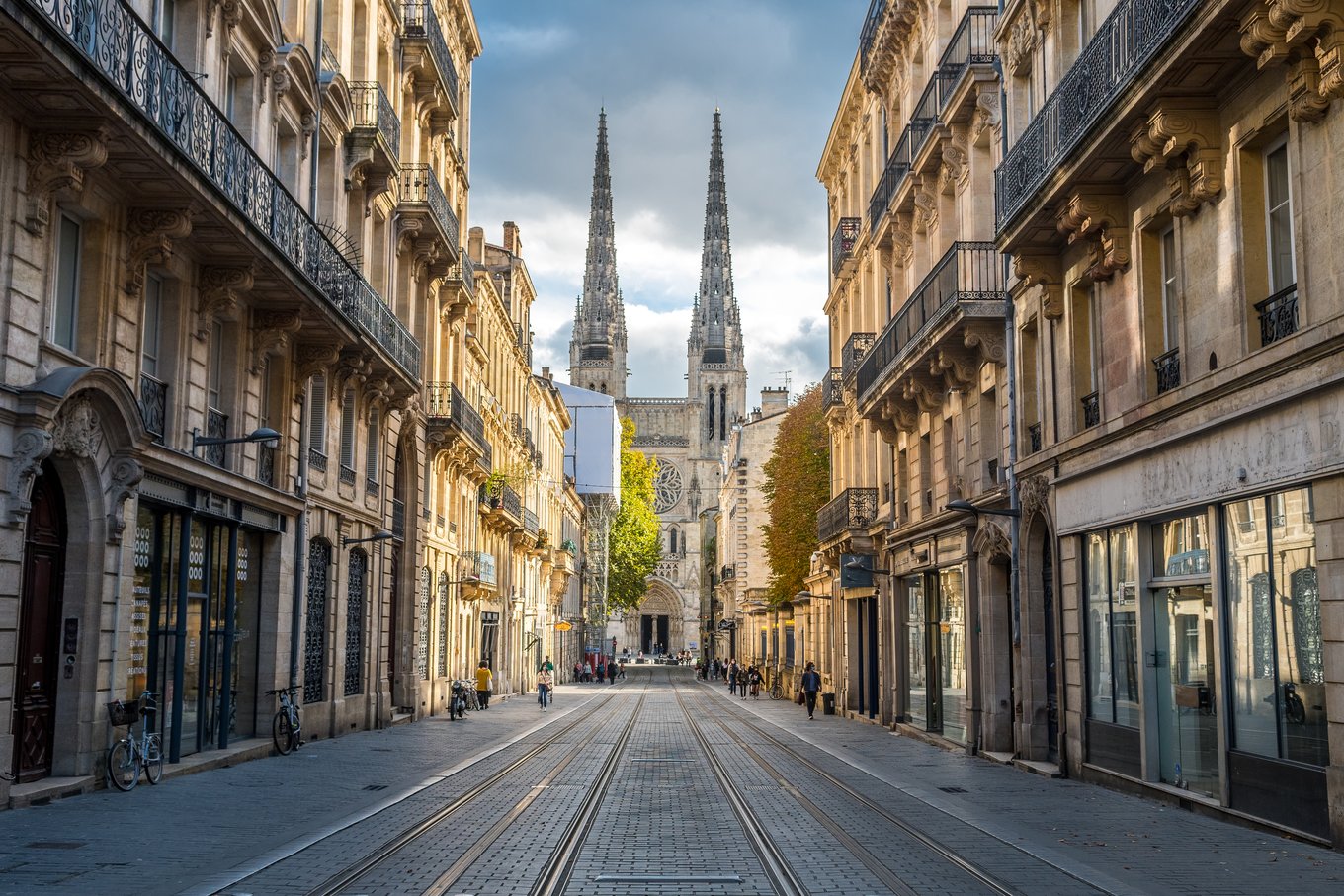 Historic street view of Bordeaux with Saint-André Cathedral in the distance