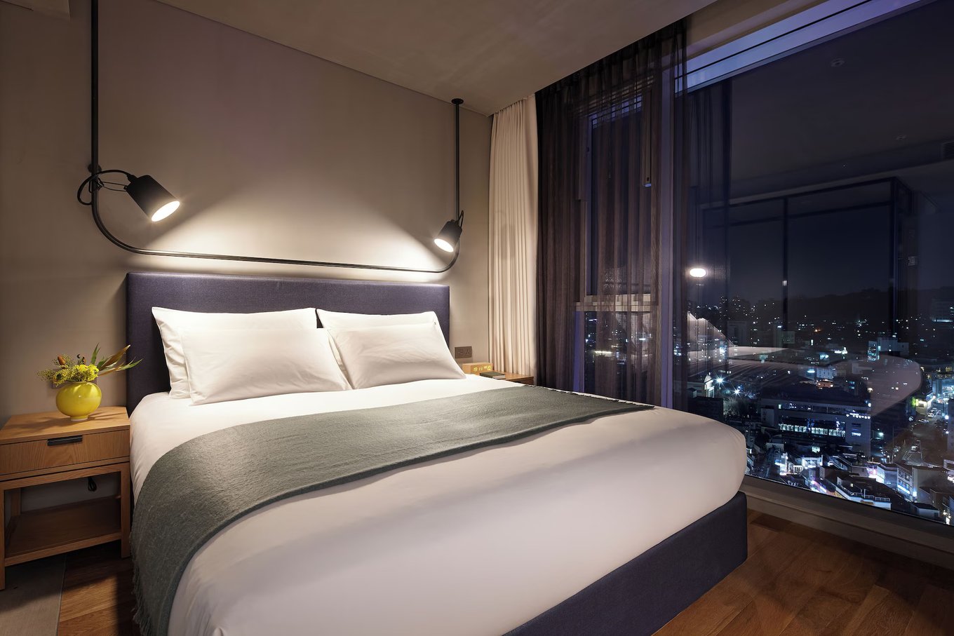Modern hotel room with Seoul skyline view at L7 Hongdae in Hongdae district