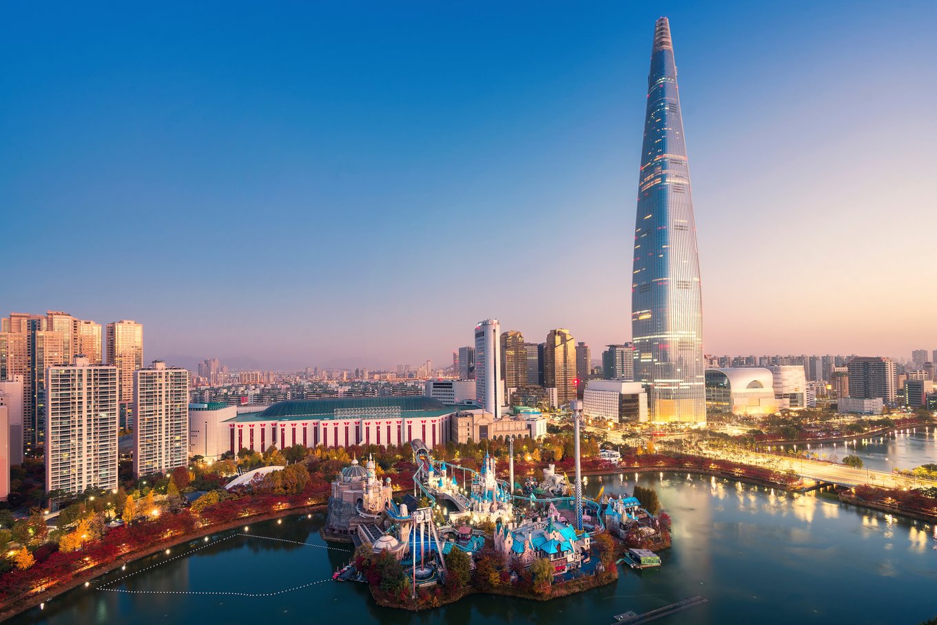 Lotte World Tower skyline view in Seoul at sunset with cityscape and lake