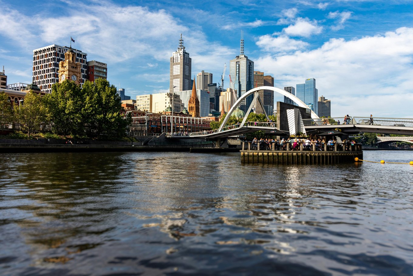 A group of people on a cruise along the Yarra River.