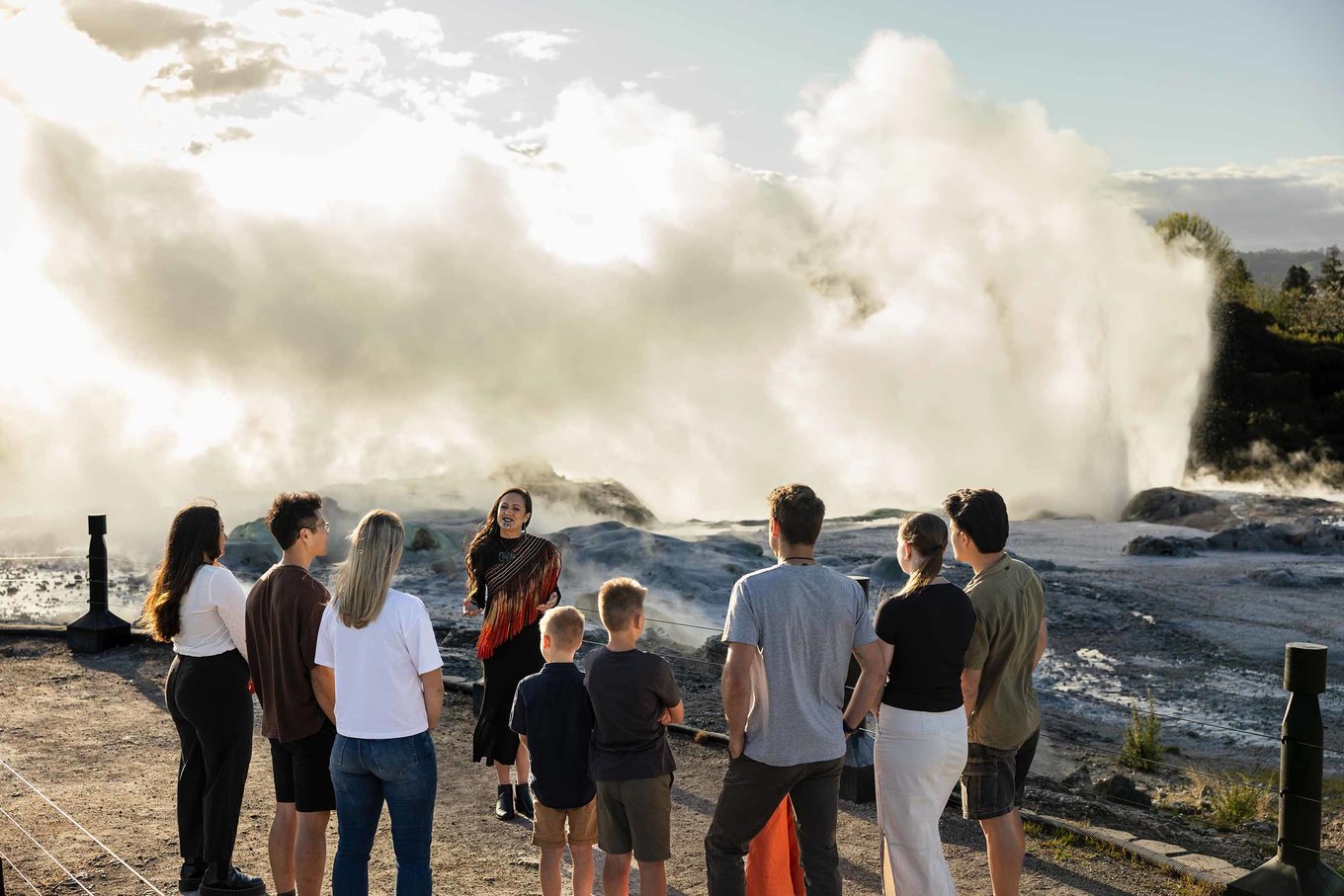 Visitors watching steam rise at Te Puia Rotorua