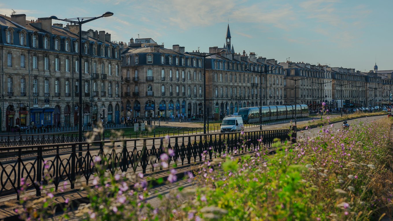 Charming view of historic buildings and tram in Bordeaux, France | Photo Credit: TBD Traveller on Pexels