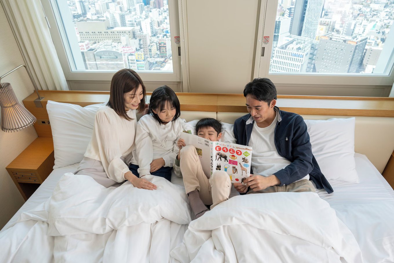 A family in a room in Nagoya JR Gate Tower Hotel, a hotel in Nagoya