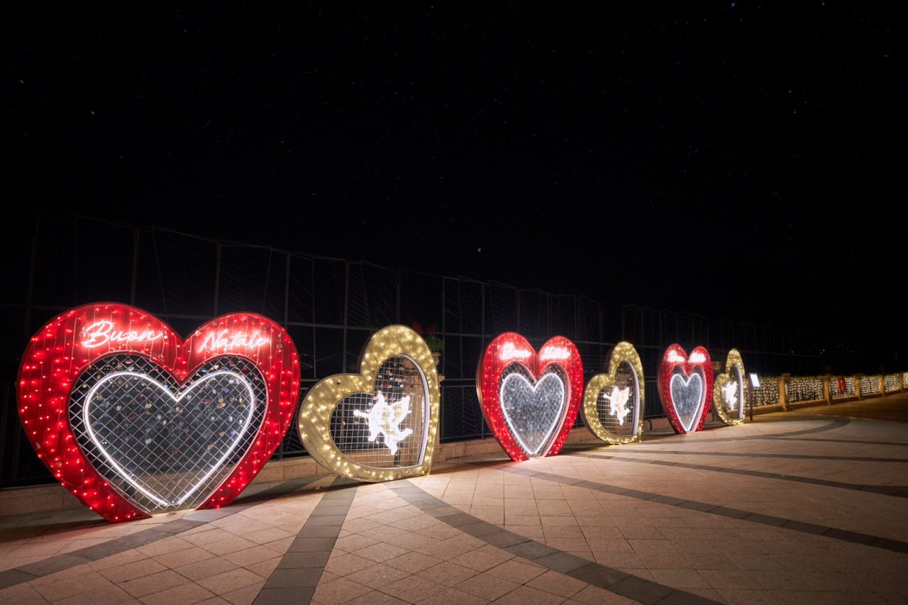 Love Lock Promenade adorned with LED string light and angel graphic in neon light