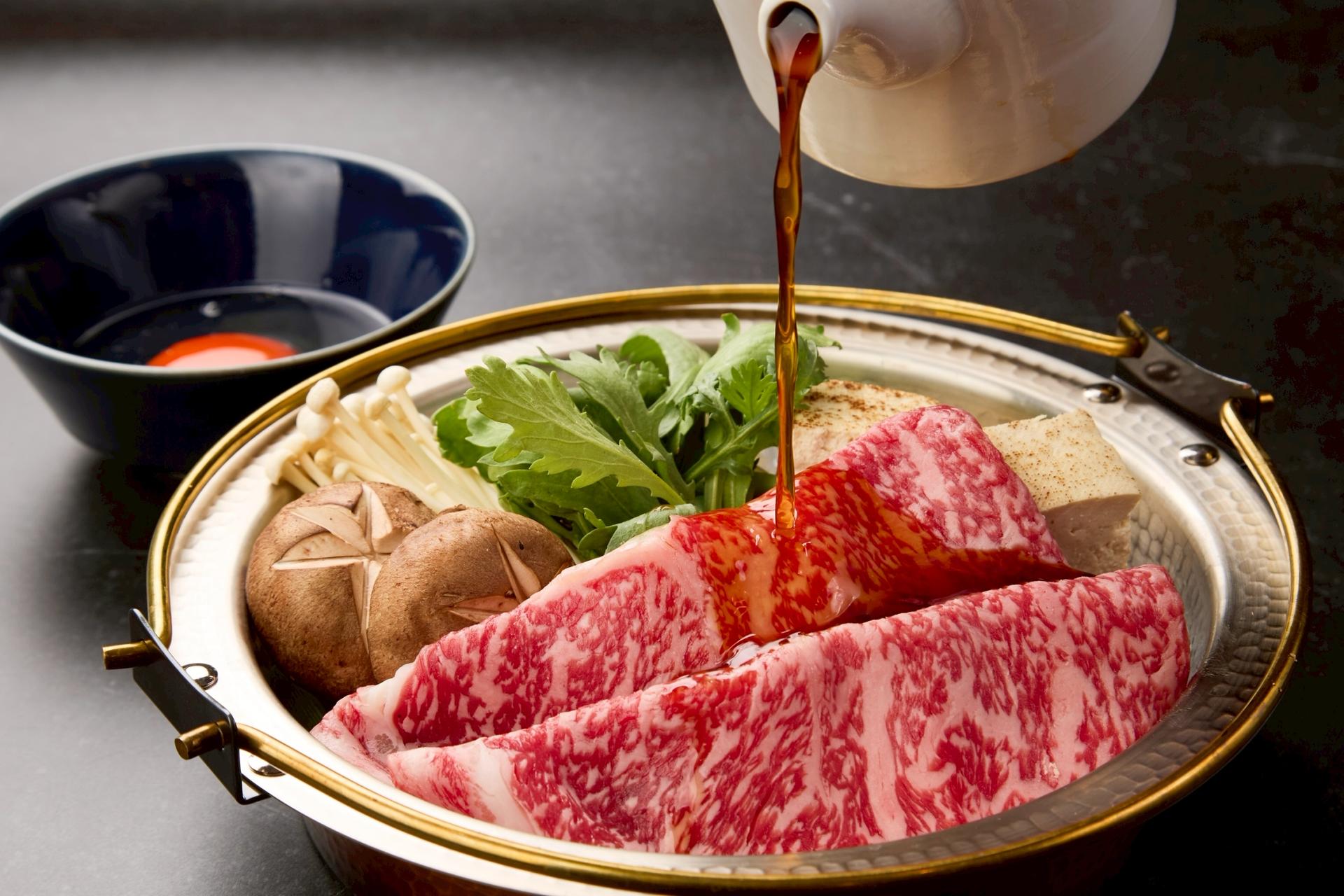 Experience Authentic Japanese Sukiyaki in Vibrant Dotonbori, Osaka - Thumbnail 3