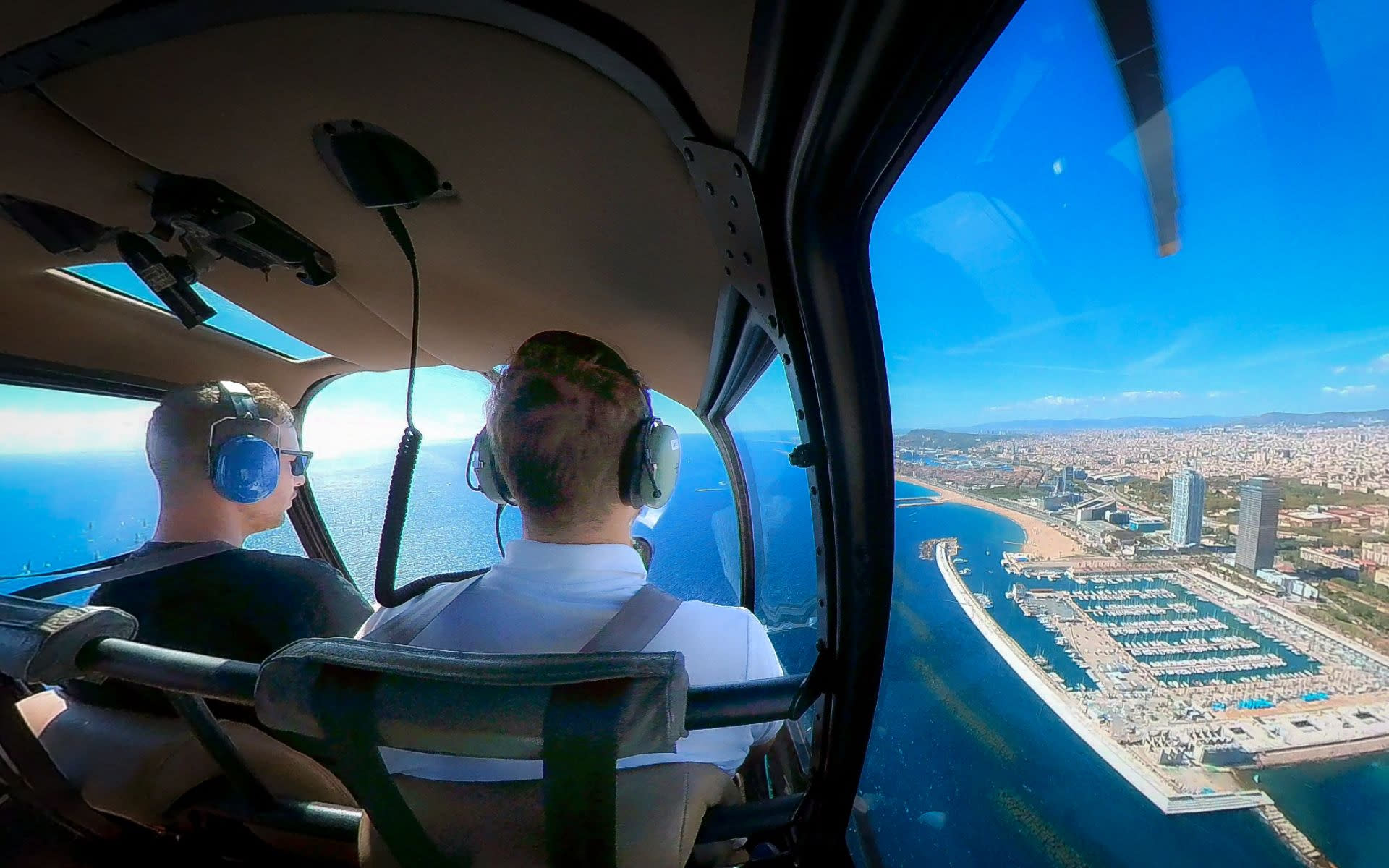 Panoramic helicopter & yacht sailing experience in Barcelona - Thumbnail 6
