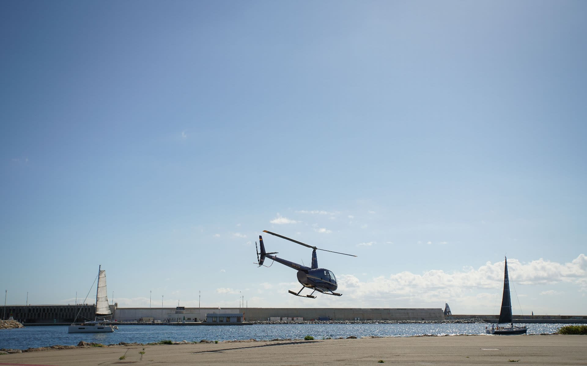 Panoramic helicopter & yacht sailing experience in Barcelona - Thumbnail 2