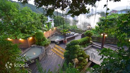 The terraced open-air hot spring pools at Spring City Resort, stepping down through greenery