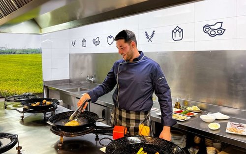 Paella cooking class with optional central market tour in Valencia
