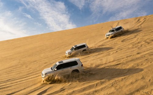 Doha Private Half-Day Desert Safari with Dune Bashing & Camel Ride