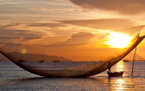 Hoi An : Excursion en bateau au coucher du soleil avec expérience de pêche au filet