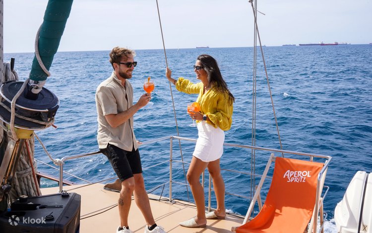 Catamaran cruising off Barcelona with skyline and Mediterranean views