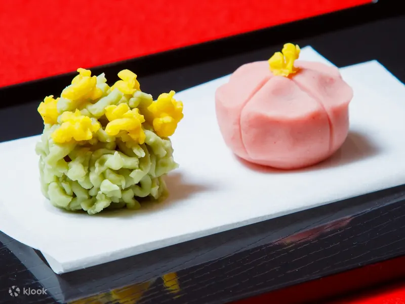 Hand-shaped seasonal wagashi sweets on a plate in Kyoto