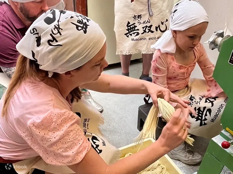 Children making fresh ramen noodles at a workshop in Kyoto