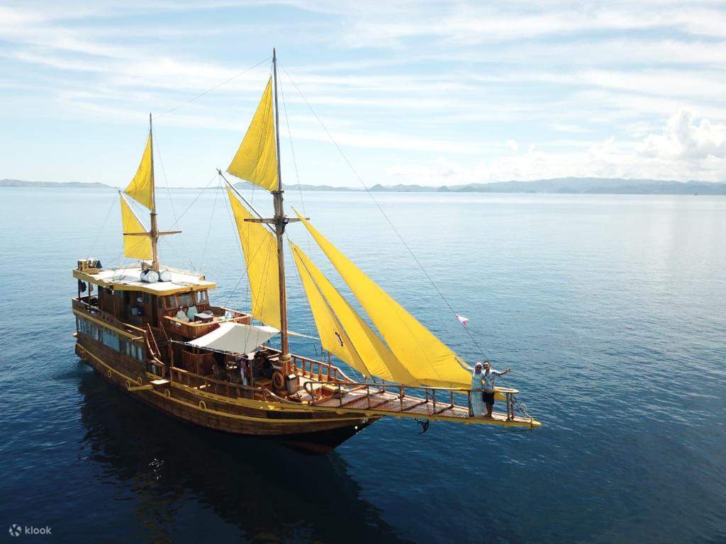 Phinisi boat sailing through Komodo National Park