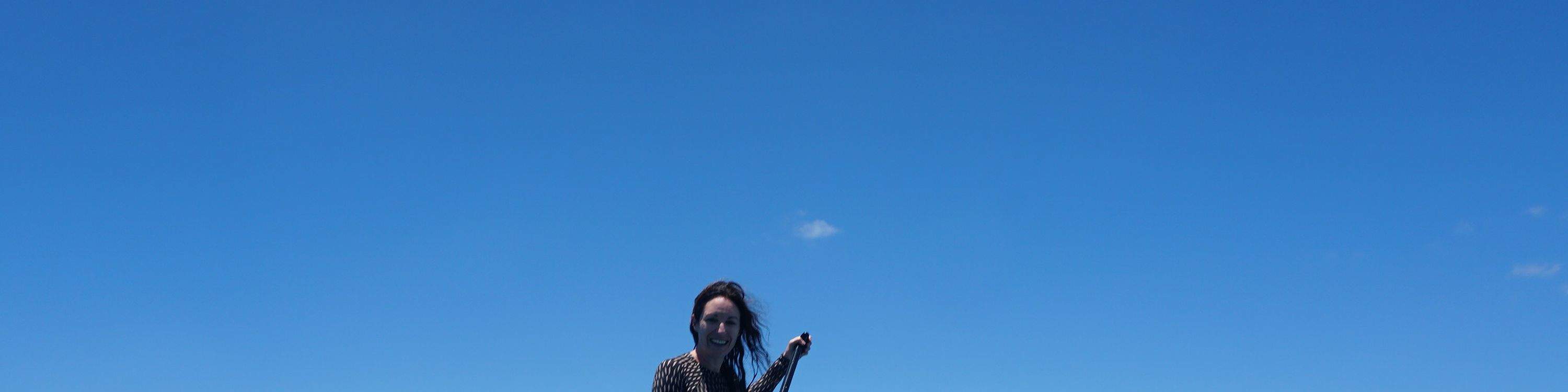 Paddling alongside a Hawaiian green sea turtle near the scenic Makaha coastline