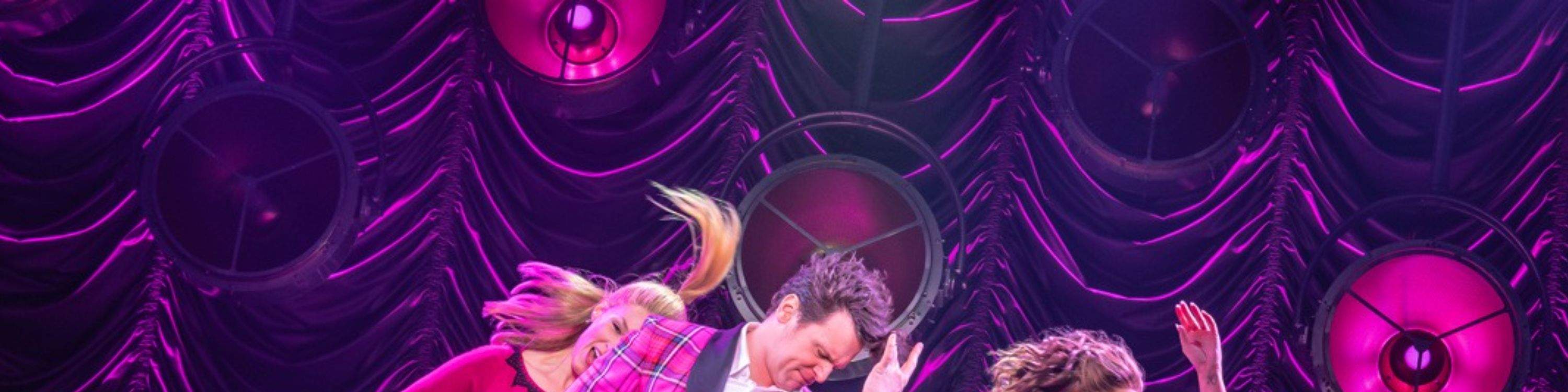 A dazzling dance number lights up the stage, full of swing, rhythm, and vintage flair