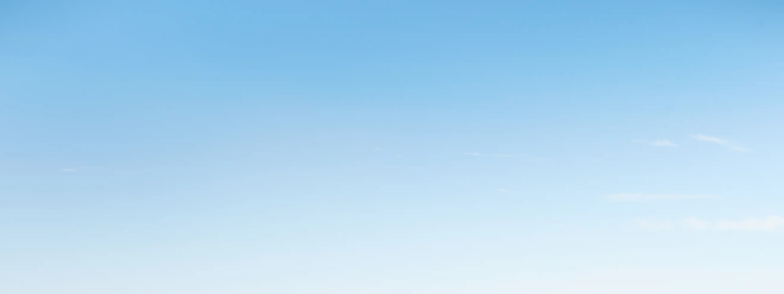 blue sky and green land with luge