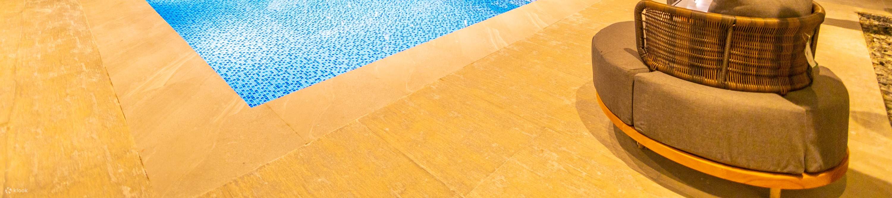 Indoor swimming pool with white and blue tiles