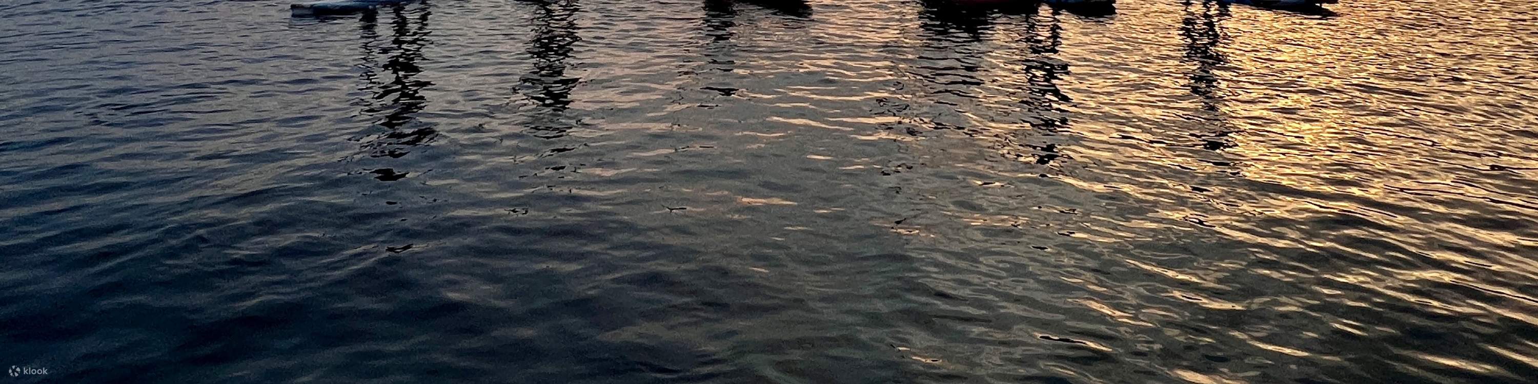 Sunset's lingering glow, the sun slowly descends.