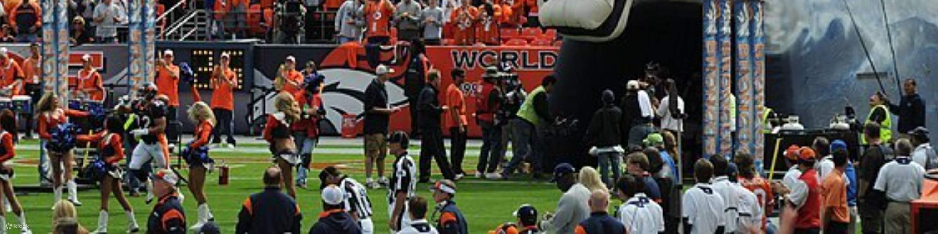 Fans cheer as the opening ceremony lights up Empower Field at Mile High