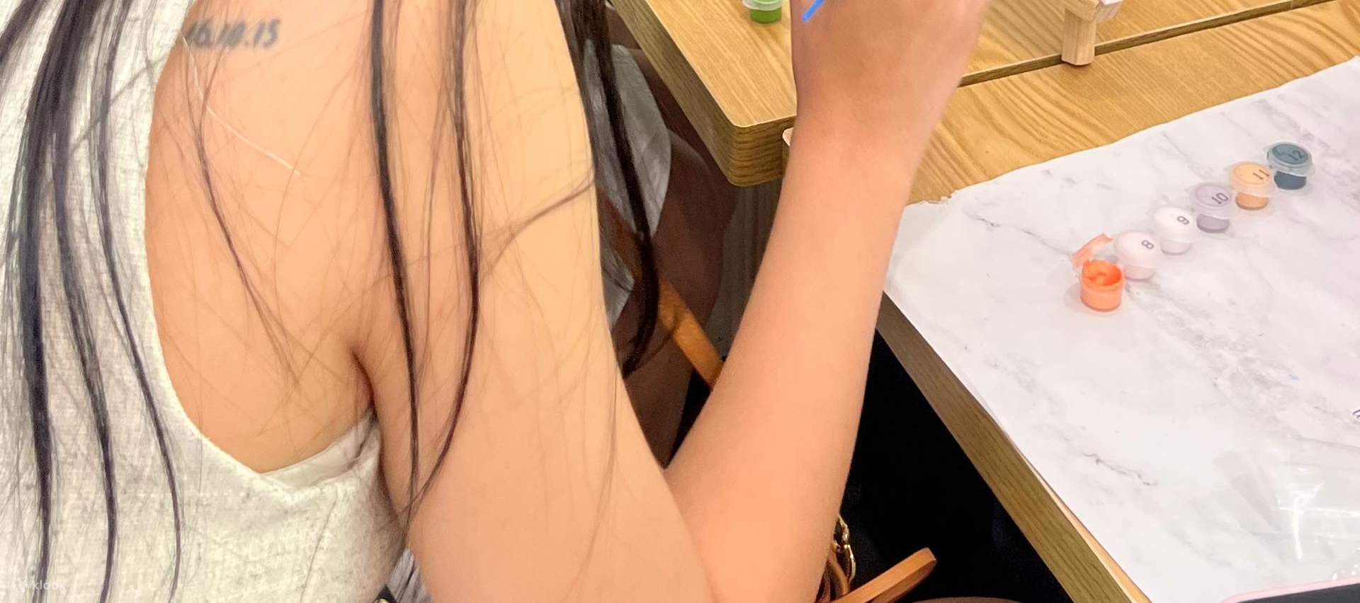 Couples painting together — a simple, cozy date activity.