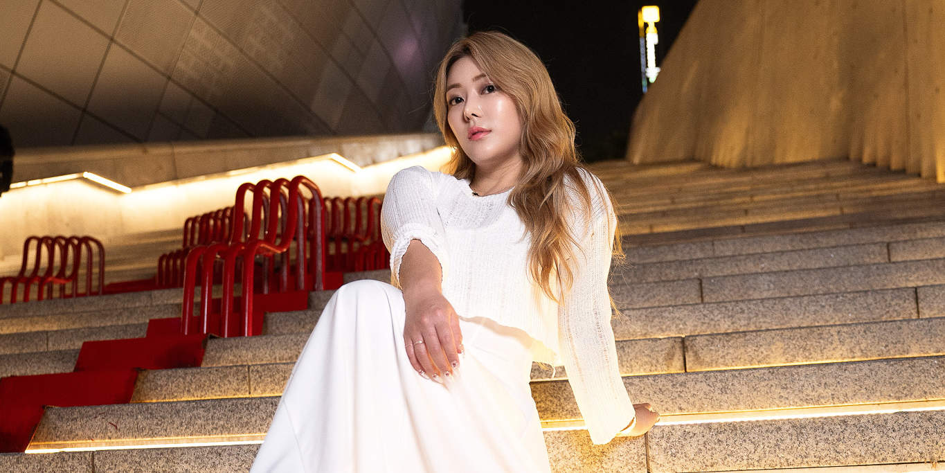 Dreamy nighttime photoshoot under Dongdaemun’s glowing lights – a magical Seoul memory.