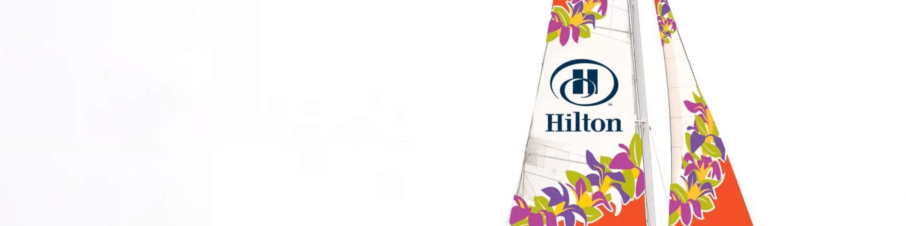 Sailing proudly aboard Spirit of Aloha, cutting across shimmering coastal waves