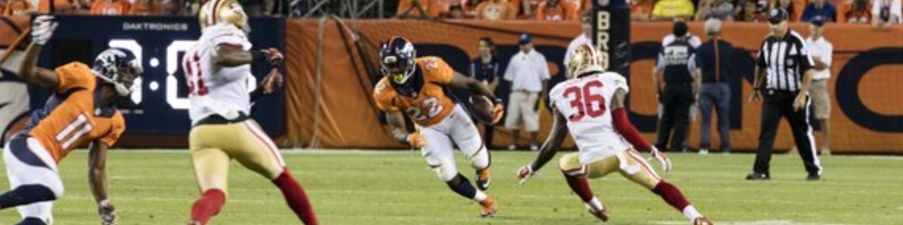 Broncos players in action on the field during a thrilling NFL showdown