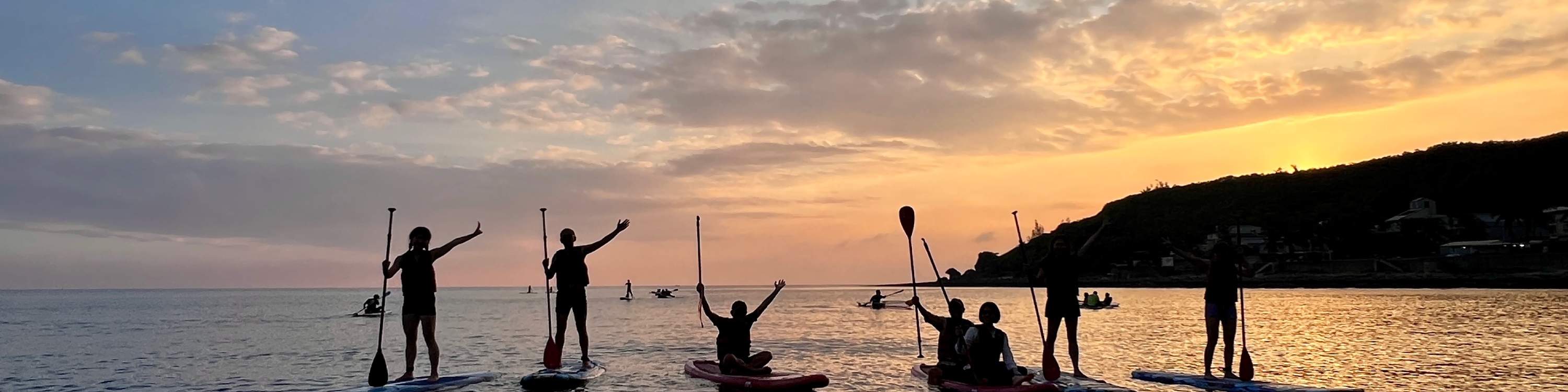 Sunset's lingering glow, the sun slowly descends.