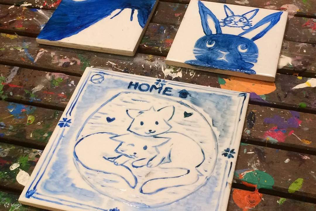cats painted on tile in arita in aura art causeway bay