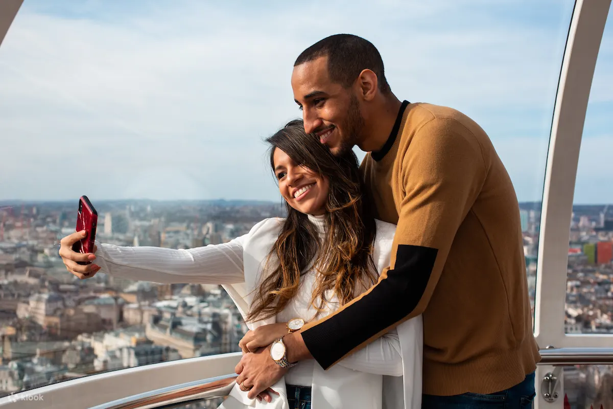 couple taking selfies at London Eye