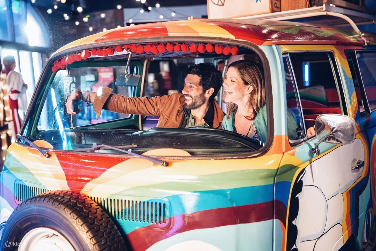 Two people taking a selfie in a vehicle