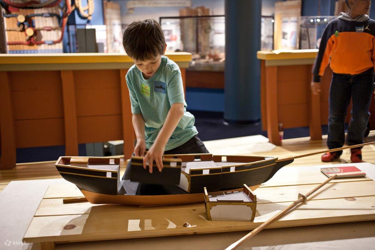 Boy playing with a boat