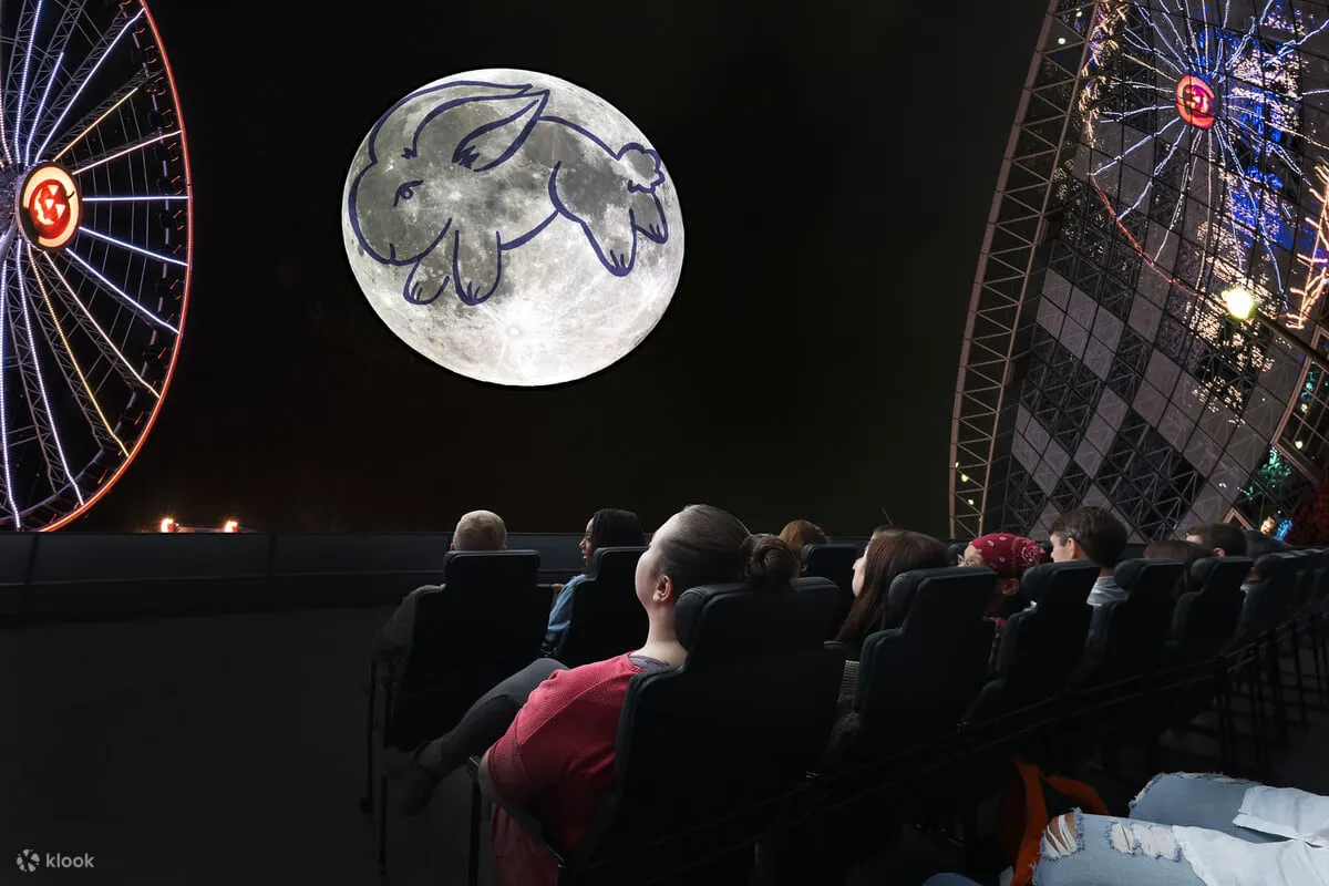 People looking at a drawing on the moon