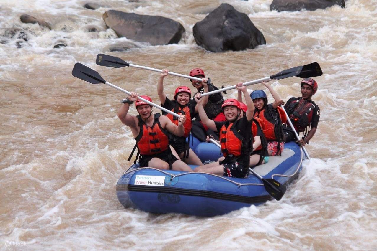 A group of people participating in white water rafting activities