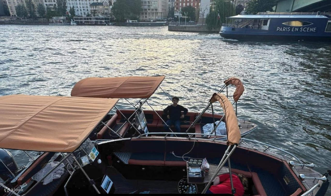 Comfortable private boat with stunning Eiffel Tower backdrop and chilled champagne served onboard